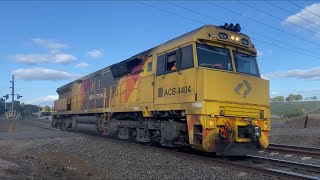 Aurizon locomotive ACB4404 with QR National logos running light at Evan’s Rd Lovely Banks 1082024 [upl. by Alleacim]