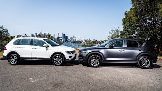 2019 Mazda CX5 vs 2019 Volkswagen Tiguan  Best Compact SUVs [upl. by Rehotsirhc]