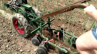 Planet jr Bp1 hilling garlic walk behind tractor cultivating [upl. by Sarajane]