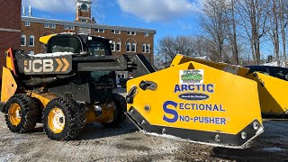 Snow plowing apartments with skid steer [upl. by Ahtekahs469]