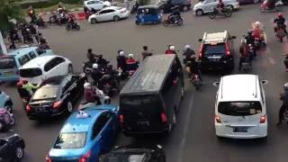 Jakarta Indonesia  traffic at a busy intersection [upl. by Ailahtan]