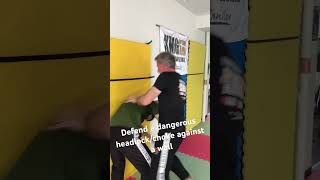 How to defend a dangerous headlockchoke while pinned against a wall kravmaga defendingheadlock [upl. by Ahsian]