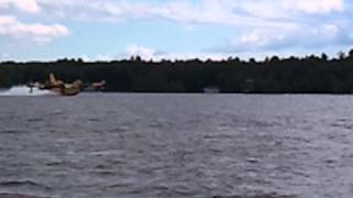 quotSuper ScooperquotWaterBelly Dump Plane Picking Up Water to Fight A Fire in Muskoka July 24 2012 [upl. by Nyleuqaj]