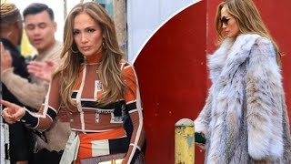 Jennifer Lopez 54 shows off her toned frame in printed dress and lavender fur coat as she attends [upl. by Ahsilem]