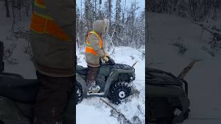 Winching frozen snowmobile with quad [upl. by Renado267]