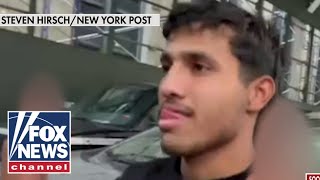 Migrants accused of beating NYC cops flipping off press [upl. by Creedon]