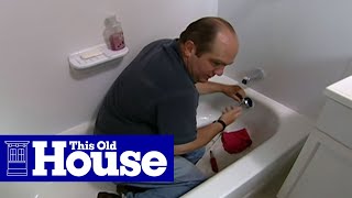 How to Clear a Clogged Bathtub Drain  This Old House [upl. by Niotna]