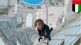 French Spiderman climbs skyscraper Extreme urban climber Alain Robert scales Dubai’s Cayan Tower [upl. by Fabria]