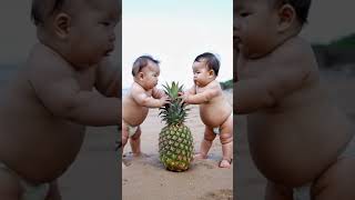 Two babies are playing with a big pineapple [upl. by Sucramad]