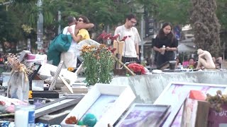 A fountain in central Tel Aviv turned into a memorial as Israelis mark October 7 anniversary [upl. by Amelina]