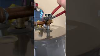 Installing brass fittings on top of a water heater [upl. by Weed552]