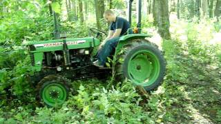 Pulling logs out of creek with a Yanmar 240D diesel [upl. by Suinuj]