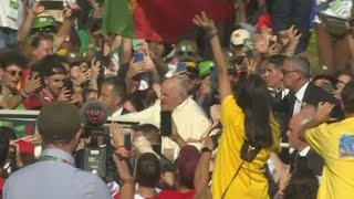 Crowds of pilgrims cheer Pope Francis at World Youth Day in Lisbon  AFP [upl. by Nongim]