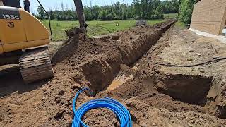 Excavator Digging A Trench For Water And Electric Service [upl. by Gnilrad]