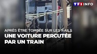 Après être tombée sur les rails  une voiture percutée par un train [upl. by Melak]