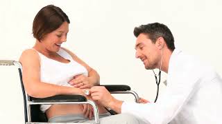 Pregnant Woman in Wheelchair receiving Doctors Help on White Background Video  WaveBreak Media [upl. by Enovad]