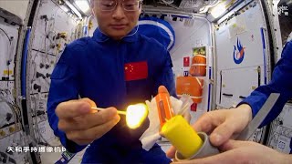 Chinese astronauts light candle with match on Tiangong space station to show flame behavior [upl. by Einnil990]