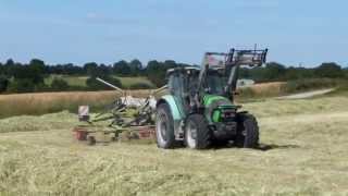 Andainage 2014 avec deutzfahr et un andaineur claas doubles toupies [upl. by Hpeseoj]