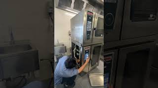 Technician testing a freshlyinstalled combi oven [upl. by Ross]