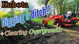 Kubota BX  Digging A Ditch With The FEL  Clearing Overgrowth [upl. by Ardnatal]