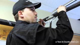 How to Adjust the Chain Tension of Garage Door Opener  Town amp Country Door LLC [upl. by Jefferey]