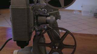 Loading and Rewinding an 8mm Projector Revere 85 [upl. by Alrad]