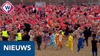 Nieuwjaarsduik 2019 Duizenden rennen naar de zee  OMROEP WEST [upl. by Ferdinana]