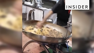 An Italian chef cooks seafood spaghetti in a giant pan [upl. by Aivata]