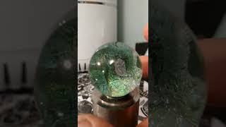 Dichroic glass marble can display multiple different colors depending on lighting conditions [upl. by Anaoj]