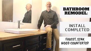 Bathroom remodel Finishing the install wood countertop faucet vanity [upl. by Ehtnax]