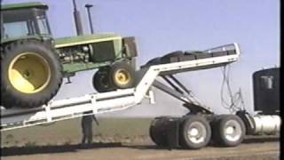 Landoll tilt bed trailer loading the tractor [upl. by Ssepmet]