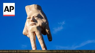 New Zealand city waves goodbye to disturbing hand sculpture after 5 years [upl. by Ileak]