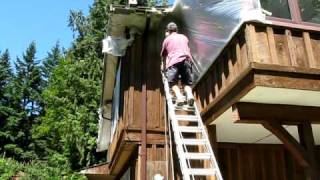 Spraying SolidCoat Stain on Cedar Sidingavi [upl. by Halyak]