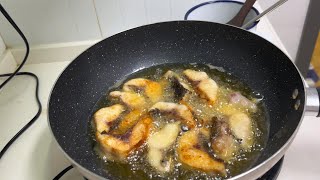 Fresh grass carp cut into chunks and fried in oil [upl. by Anoyek]