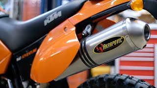 KTM 640 Adventure LC4 Akrapovic Exhaust Installation and Comparison [upl. by Ffoeg]