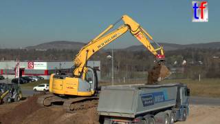 New Holland E235B SR Loads Dump Trailer  Sattellkipper Waiblingen Germany 09032015 [upl. by Aicel]