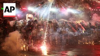 Protesters throw fireworks at police in Tbilisi after Georgias EU bid was suspended [upl. by Yblek]