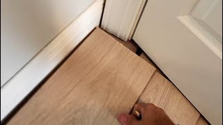 Installing laminate floor under doorway [upl. by Winstonn]