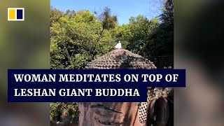 Woman meditates on top of Leshan Giant Buddha in China [upl. by Uhn]