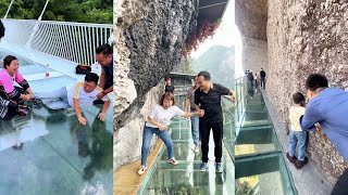 😱Tourist terrified by new glass walkway that cracks under weight  Scariest Cliffside Glass Walkway [upl. by Esiole]