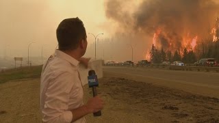 Caught on camera Fort McMurray fire erupts behind Global News reporter [upl. by Ernesto65]