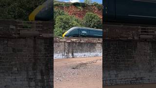 GWR class 800 skips across the top of coryton cove Paddington to Newquay800313 IET Hitachi train [upl. by Cypro]