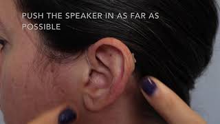 How to put on and remove a behindtheear hearing aid [upl. by Garrek979]