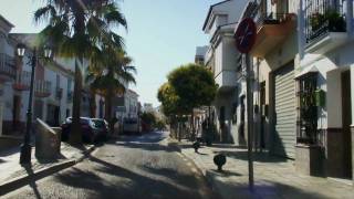 Driving through the main street of Manilva Andalucia Spain [upl. by Lemrahs909]