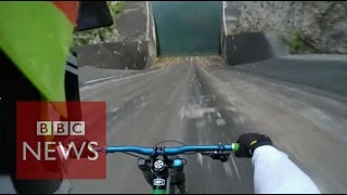 Biker films insane 60m bike dam drop in Slovenia  BBC News [upl. by Alitha]