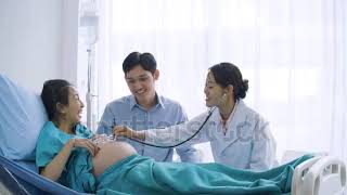 stock footage doctor use stethoscope to examine pregnancy woman [upl. by Novar]