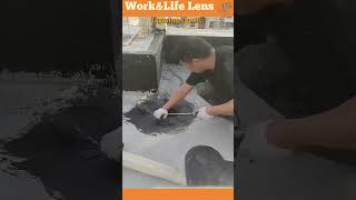 Worker applies bitumen sheets to flat roof holes fusing with heat for waterproofing [upl. by Oniram873]