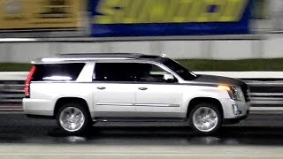 2015 Escalade vs 2015 Mustang GT  14 Mile Drag Race  Road Test TV ® [upl. by Pachston389]