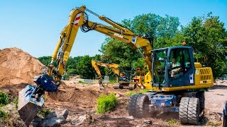 Bagger ATLAS 140W mit OilQuick [upl. by Nyltiac]