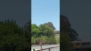 Train passes the Morayfield shopping centre on a sunny day [upl. by Essirahs]